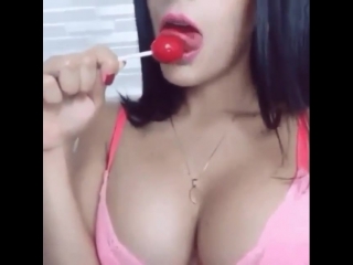 cutie very juicy and hot sucks and licks a lollipop with a sweet tongue, non-porn, tits, ass, phyton