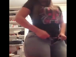 plump young girl takes off her jeans to show her huge tight ass, non-porn